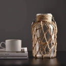 Vaso decorativo de vidro rústico pendurado feito com corda de cânhamo artística