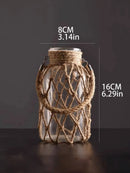 Vaso decorativo de vidro rústico pendurado feito com corda de cânhamo artística